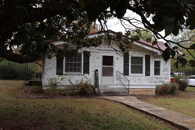 bungalow with a front lawn