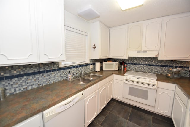 kitchen with white cabinets, white appliances, sink, and tasteful backsplash