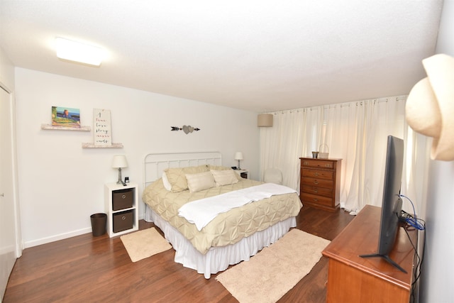 bedroom featuring dark hardwood / wood-style floors