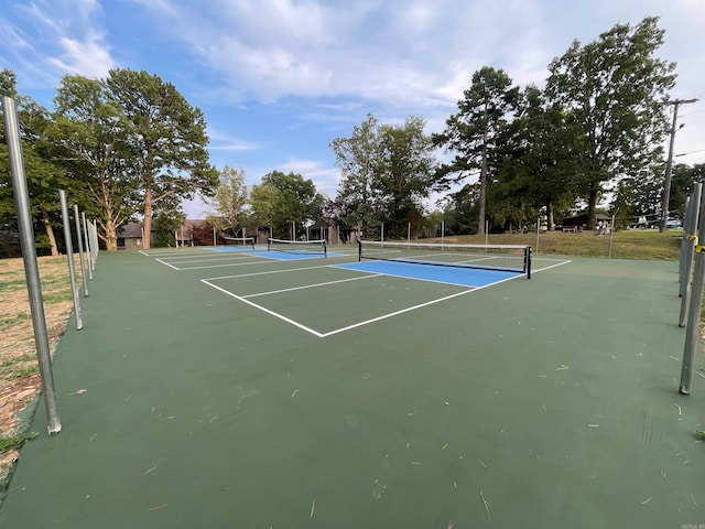 view of sport court with basketball hoop