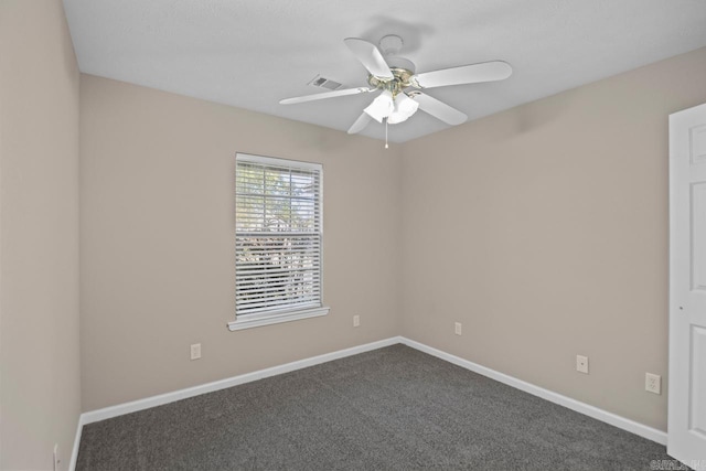 carpeted spare room with ceiling fan