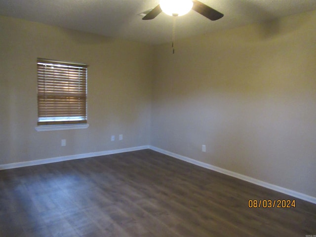 unfurnished room with ceiling fan and dark hardwood / wood-style floors