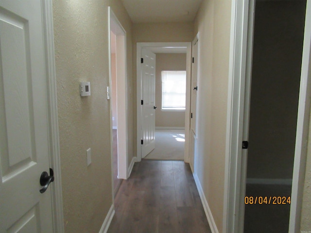 hall with dark hardwood / wood-style floors