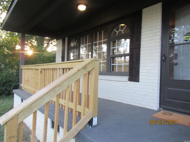 wooden terrace featuring a porch