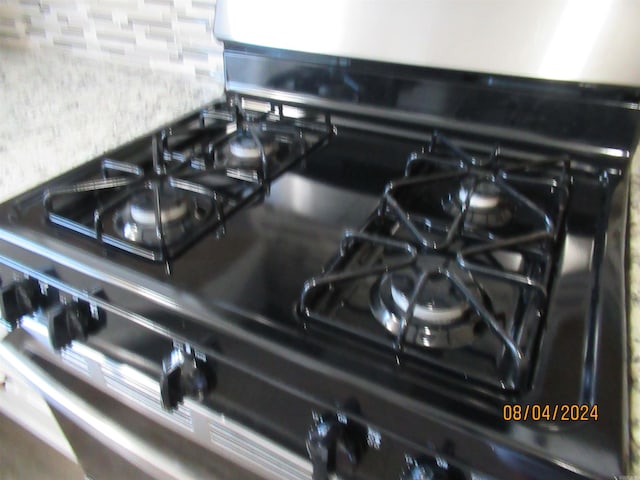 room details with black range with gas cooktop