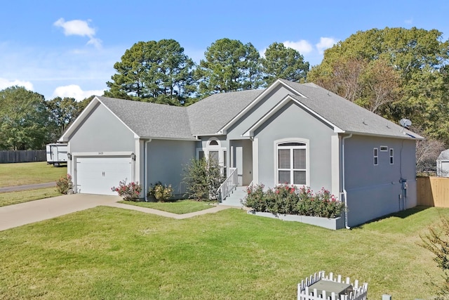 single story home featuring a front yard, a garage, and stucco siding