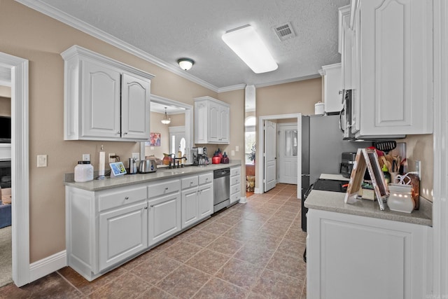 kitchen featuring white cabinetry, sink, ornamental molding, a textured ceiling, and appliances with stainless steel finishes