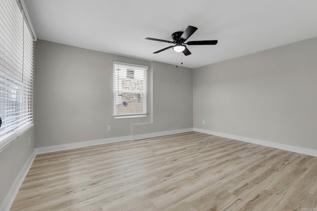 spare room with ceiling fan and light hardwood / wood-style flooring