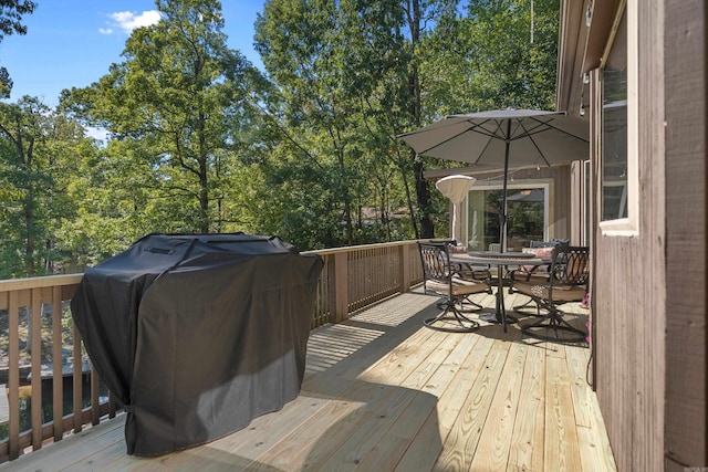 wooden deck featuring grilling area