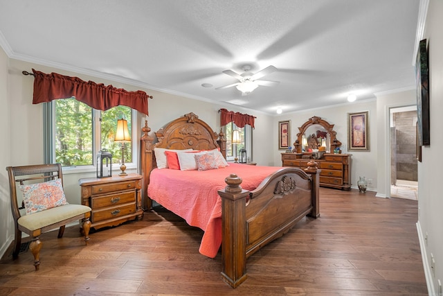 bedroom featuring ensuite bath, ornamental molding, a textured ceiling, ceiling fan, and hardwood / wood-style flooring