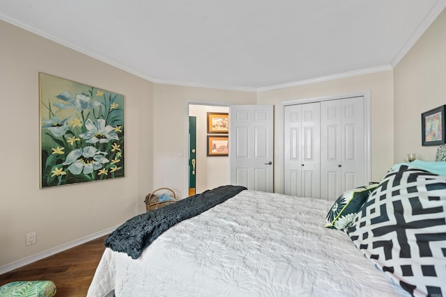 bedroom with crown molding, a closet, and dark wood-type flooring