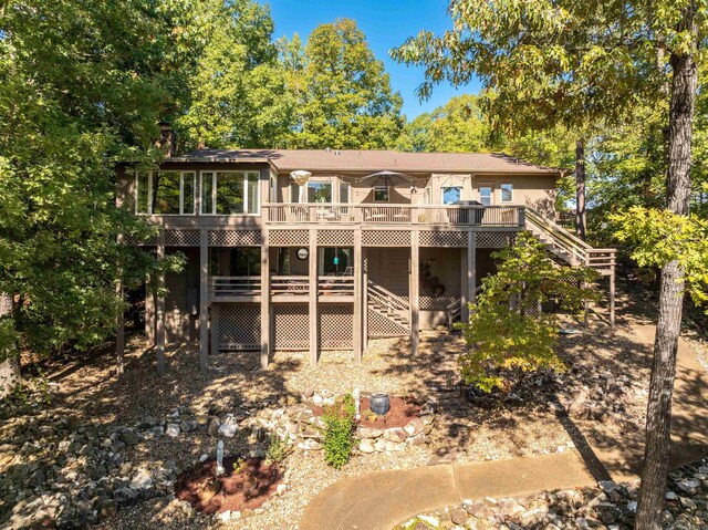 back of property with a wooden deck