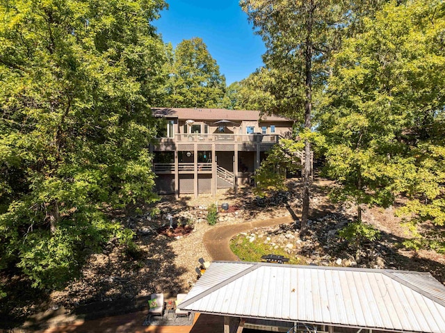 back of property featuring a deck