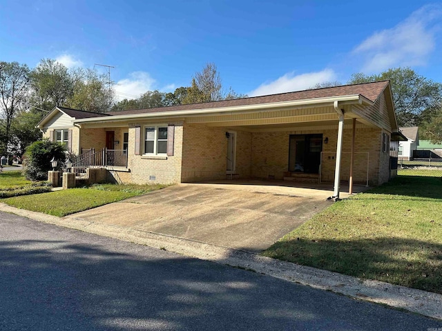 ranch-style house with a front yard and a carport