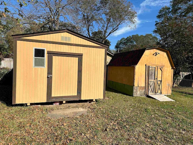 view of outbuilding with a lawn