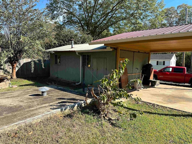 view of home's exterior with a carport