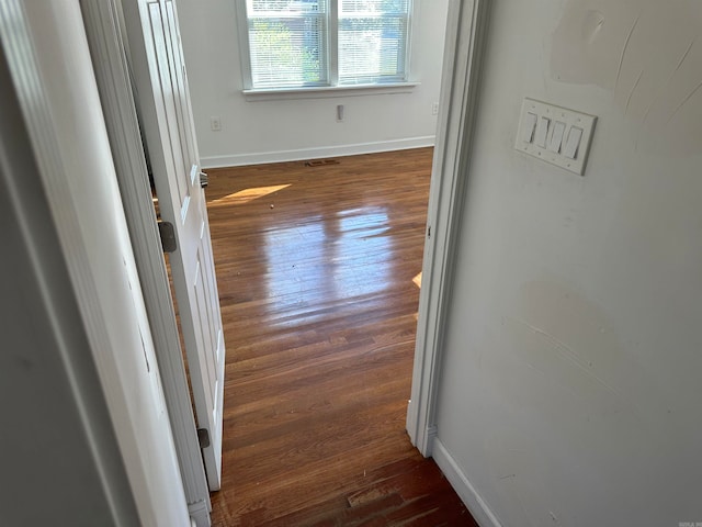 hall featuring dark wood-type flooring