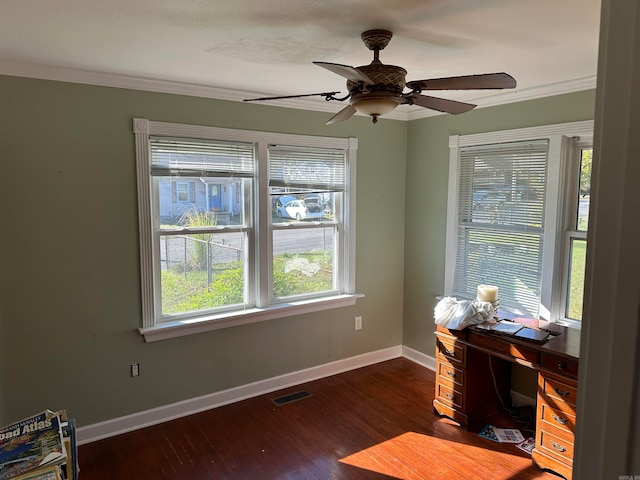 office space featuring dark hardwood / wood-style floors, a healthy amount of sunlight, ornamental molding, and ceiling fan