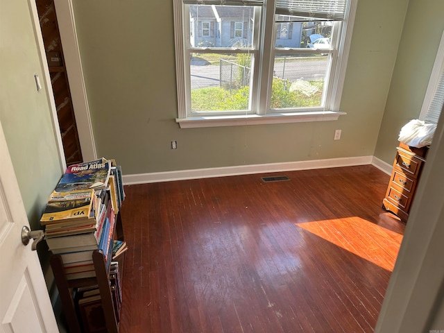 interior space with dark hardwood / wood-style flooring