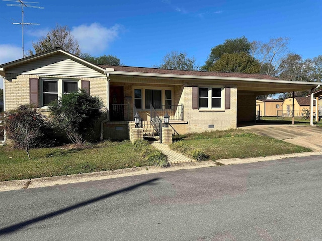 view of front of house featuring a porch and a carport