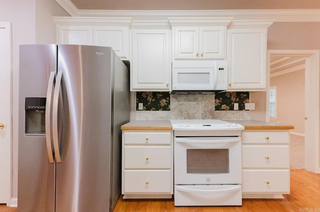 kitchen with white cabinets, decorative backsplash, white appliances, and light hardwood / wood-style flooring