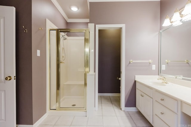 bathroom with vanity, tile patterned floors, a shower with door, and crown molding