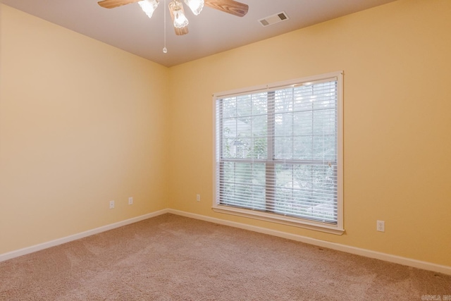 unfurnished room featuring carpet floors and ceiling fan