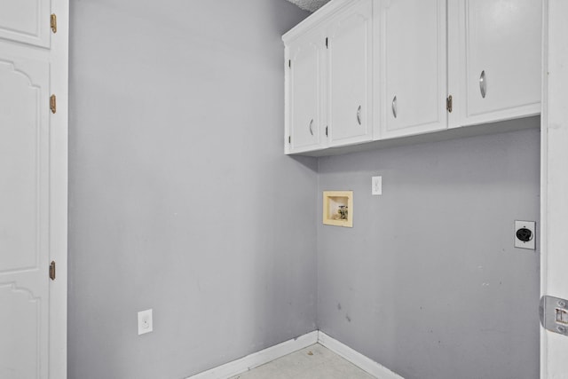 laundry room featuring hookup for an electric dryer, hookup for a washing machine, and cabinets