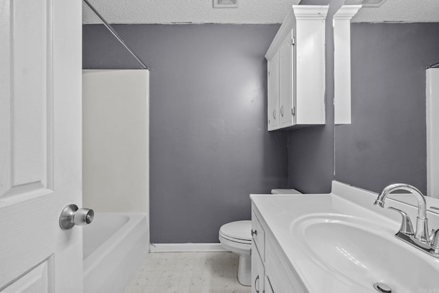 full bathroom with vanity, a textured ceiling, and toilet