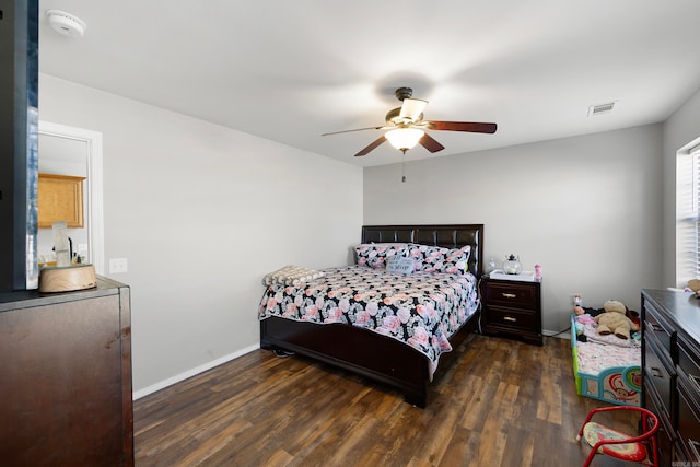 bedroom with ceiling fan and dark wood-type flooring