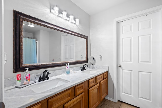 bathroom with tile patterned floors and vanity