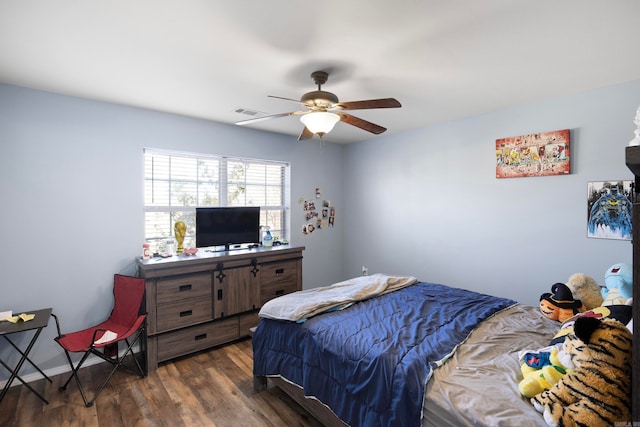 bedroom with ceiling fan and dark hardwood / wood-style floors