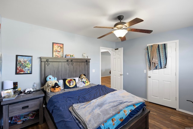 bedroom featuring ceiling fan and dark wood-type flooring