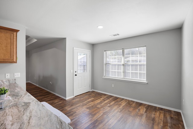 entrance foyer featuring dark hardwood / wood-style flooring