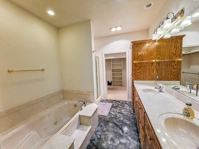 bathroom featuring vanity and shower with separate bathtub