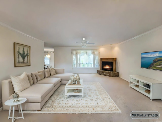 carpeted living room featuring ceiling fan and ornamental molding