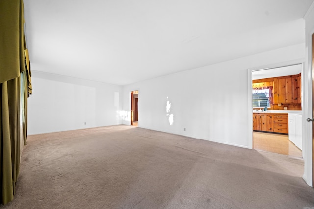 empty room with light colored carpet