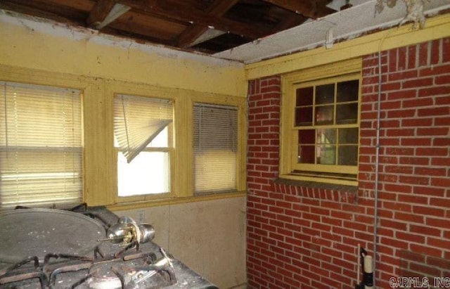 miscellaneous room featuring brick wall