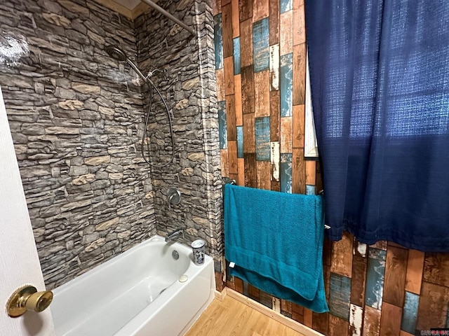 bathroom featuring shower / tub combo and hardwood / wood-style flooring