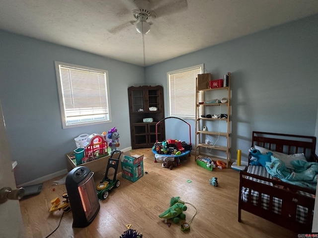 bedroom featuring ceiling fan and wood-type flooring