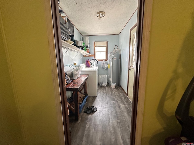 bathroom featuring crown molding, washer and dryer, a textured ceiling, water heater, and wood-type flooring