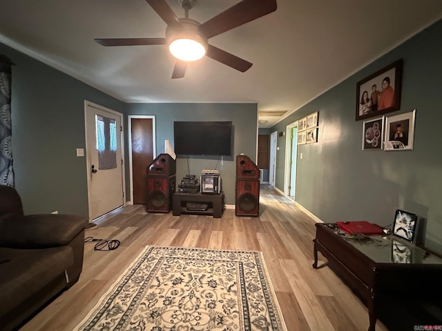 living room with ceiling fan and light hardwood / wood-style floors