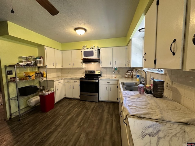 kitchen with backsplash, white cabinetry, stainless steel electric stove, and sink