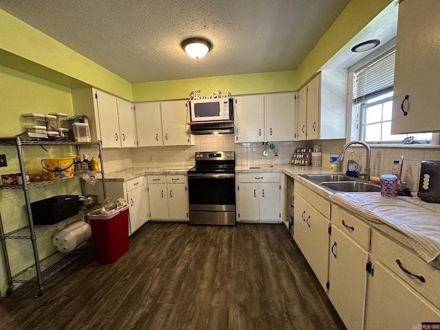 kitchen featuring white cabinetry, sink, tasteful backsplash, dark hardwood / wood-style floors, and stainless steel electric stove