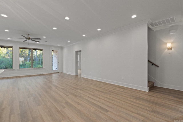 unfurnished living room with ceiling fan, light hardwood / wood-style floors, and ornamental molding