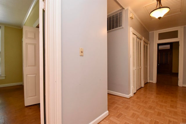 corridor featuring light parquet floors and ornamental molding