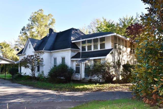 view of front of home featuring a carport