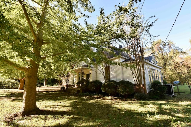 view of property exterior featuring a yard