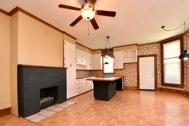 kitchen with white cabinetry, backsplash, light parquet floors, pendant lighting, and a kitchen island