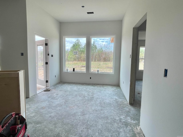 unfurnished room featuring a wealth of natural light